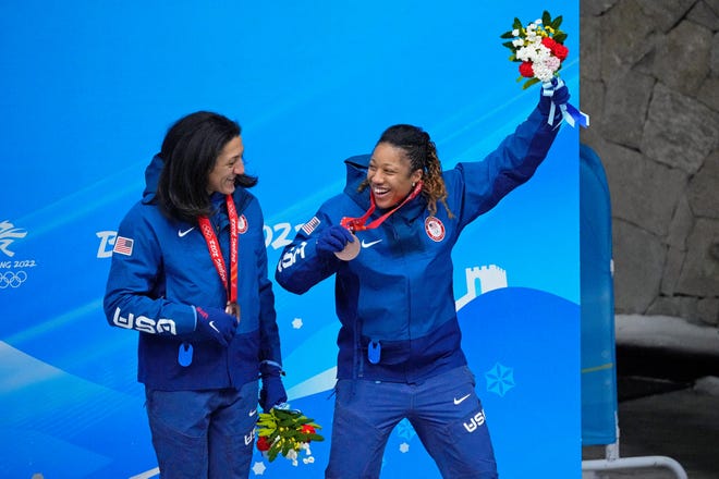 Ilana Myers Taylor and Sylvia Hoffman celebrate after winning the bronze medal in bobsled for two during the Beijing Olympics at Yanqing Ski Center.
