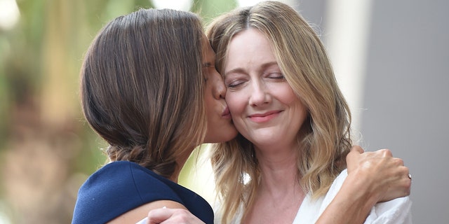 Jennifer Garner, left, kisses fellow actress Judy Greer as Garner receives a star at the Hollywood 0 Walk of Fame, August 20, 2018, in Hollywood, California.
