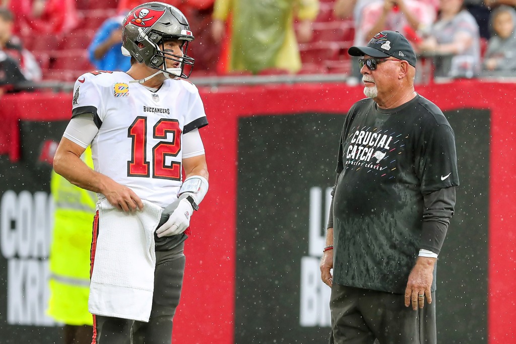 Brady and Aryan talk on the field before the Buccaneers game in October 2021