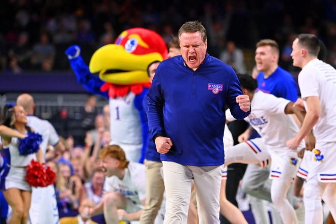 Kansas Jayhawks head coach Bill Self and the bench reaction after a game against the North Carolina Tar Heels during the second half.