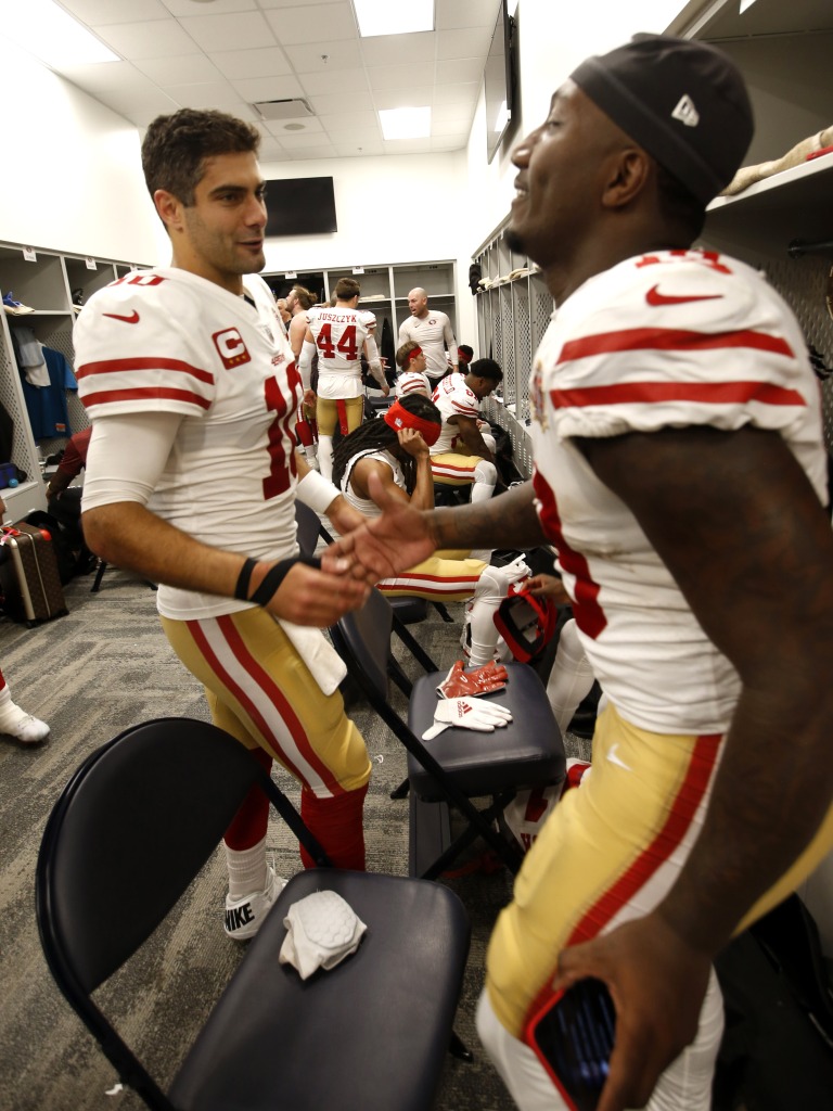 Jimmy Garoppolo (left) and Debo Samuel after losing 49 seconds to the Rams in an NFC Championship game.