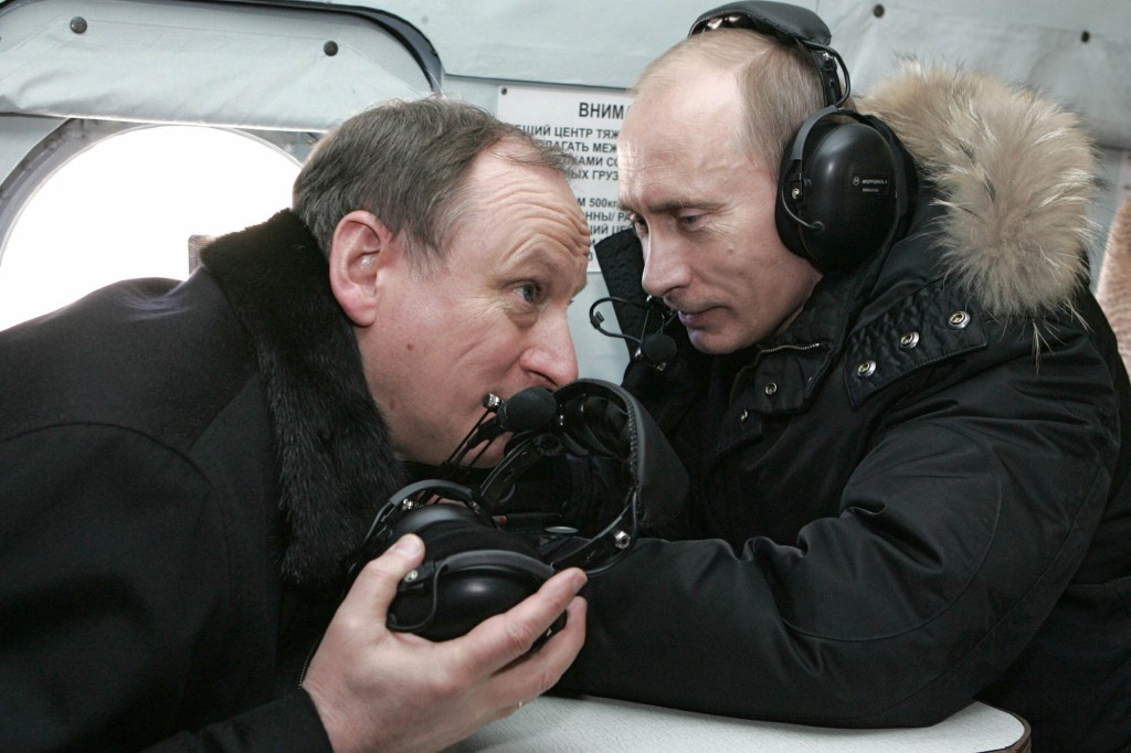 President Vladimir Putin (right) and Security Services, FSB, Commander Nikolai Patrushev (left) flies by helicopter to visit a military post in Nalchik on February 4, 2008.
