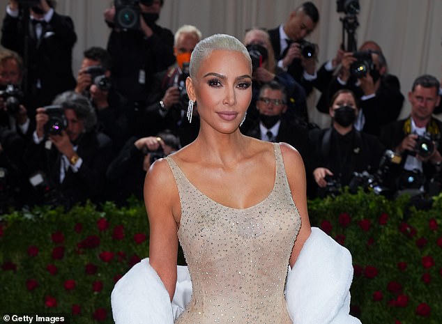 Kim Kardashian lowered her calorie intake and went for a daily run so she could wear Marilyn Monroe's dress at the Met Gala (pictured).  Nutrition experts warn against this plan