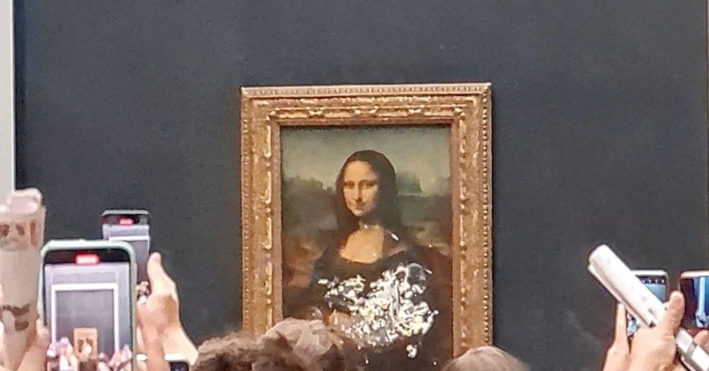 The Mona Lisa was left unharmed but smeared with cream in a climate protest stunt