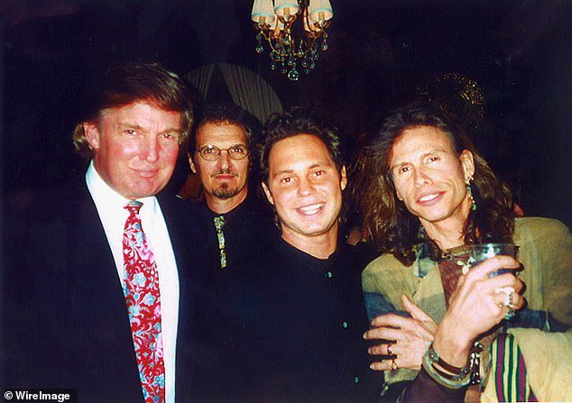 Jason Bean (second from right) pictured with Donald Trump and rock star Stephen Tyler in 2008