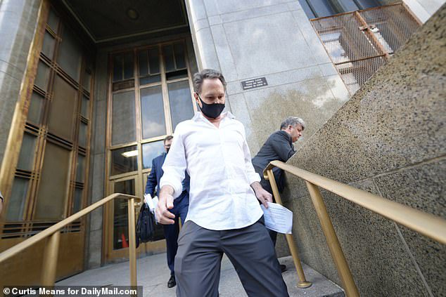 Jason Bean, 47, leaves Manhattan Criminal Court on Monday.  Arrested after allegedly molesting a girl under the age of 17