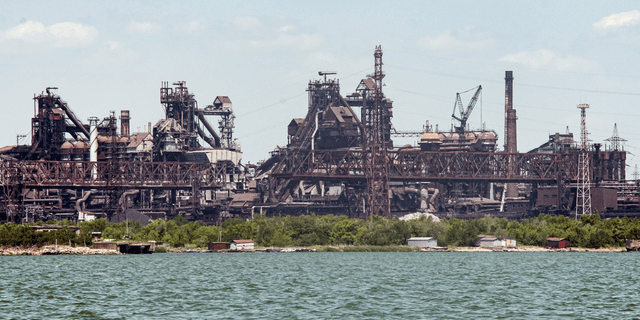 Azovstal mineral group, damaged during the fighting, is seen from the Mariupol sea port in Mariupol, Ukraine, on Monday, May 30.
