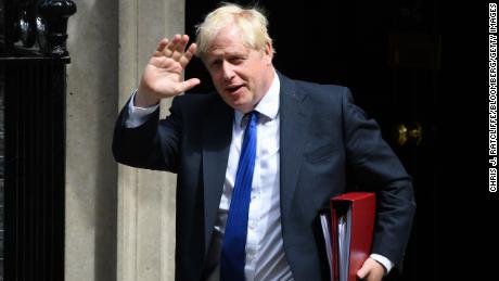 Boris Johnson clings to his premiership after dozens of British lawmakers quit and urged him to quit