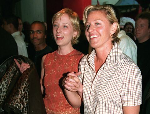 Heche, left, holds the hand of comedian Ellen DeGeneres at the movie's world premiere 