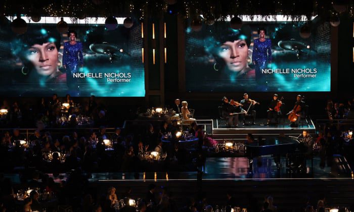 John Legend performs images of the late Nichelle Nichols during a clip 