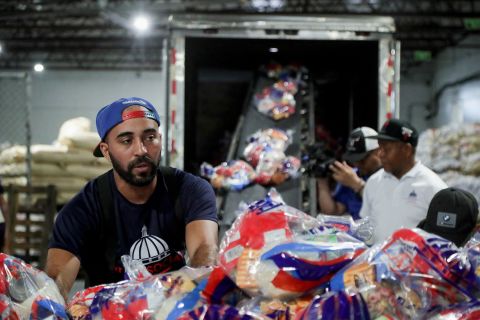 State Social Plan workers prepare food rations in Santo Domingo, Dominican Republic, on Sunday.
