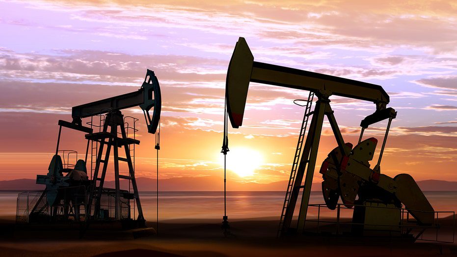 Oil wells on the background of sunset