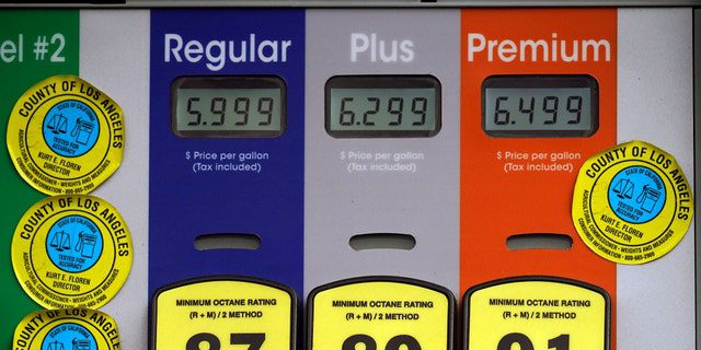 High gas prices are posted at a full-service gas station in Beverly Hills, California, Sunday, November 7, 2021. The average price of regular gasoline in the United States has jumped 5 cents over the past two weeks, to .49 a gallon.  (Photo by Associated Press/ Damien Devarganis)