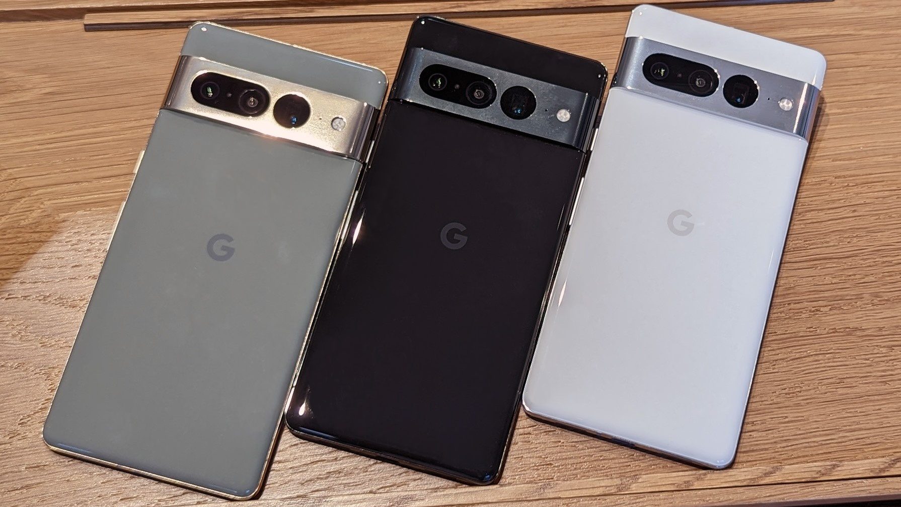 All colors of the Google Pixel 7 Pro displayed on a wooden table at the Google Fall 2022 event