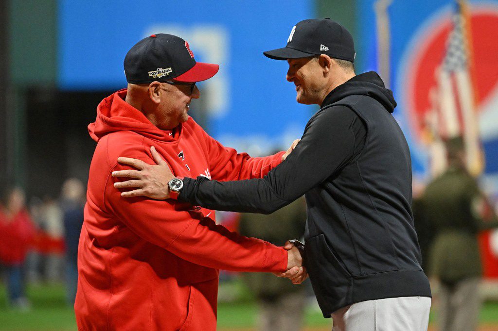 Cleveland Guardians coach Terry Francona (left) and New York Yankees manager Aaron Boone (right) shake hands before Game Three of the NLDS in the 2022 MLB Playoffs at Progress Stadium. 