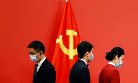 Staff prepares the podium before members of the new Politburo Standing Committee meet with the media after the 20th National Congress of the Communist Party of China, at the Great Hall of the People in Beijing.