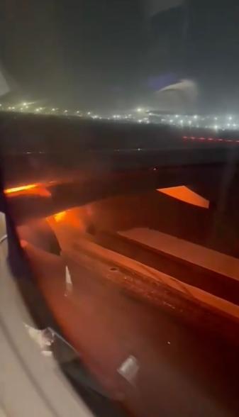 The plane takes off at Delhi airport before it catches fire.
