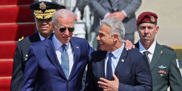 President Biden is greeted by Israeli Prime Minister Yair Lapid upon his arrival at Ben Gurion Airport.