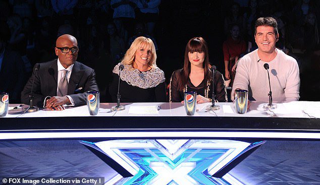 All-Stars: Britney (second left) appeared as a judge on the US version of The X Factor in 2012 with judges (L-R) LA Reid, Demi Lovato and Simon