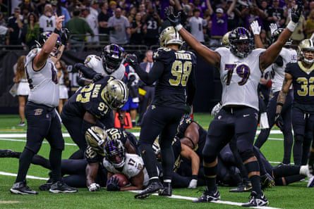New Orleans Saints defensive end Tanoh Kabasanion saves Baltimore Ravens running back Kenyan Drake