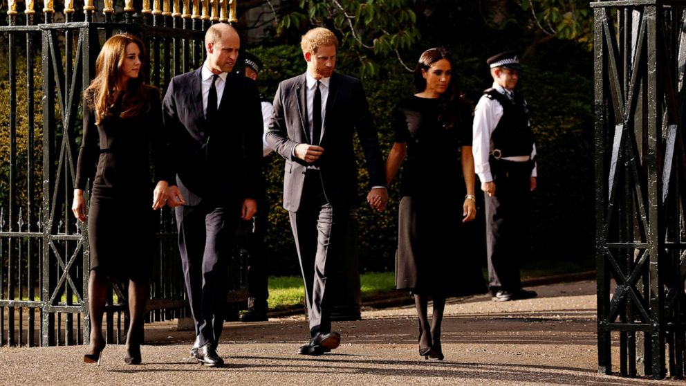 PHOTO: William, Prince of Wales, Catherine, Princess of Wales, Prince Harry and Meghan, Duchess of Sussex, walk outside Windsor Castle after the death of Britain's Queen Elizabeth II in Windsor, Britain, September 10, 2022.