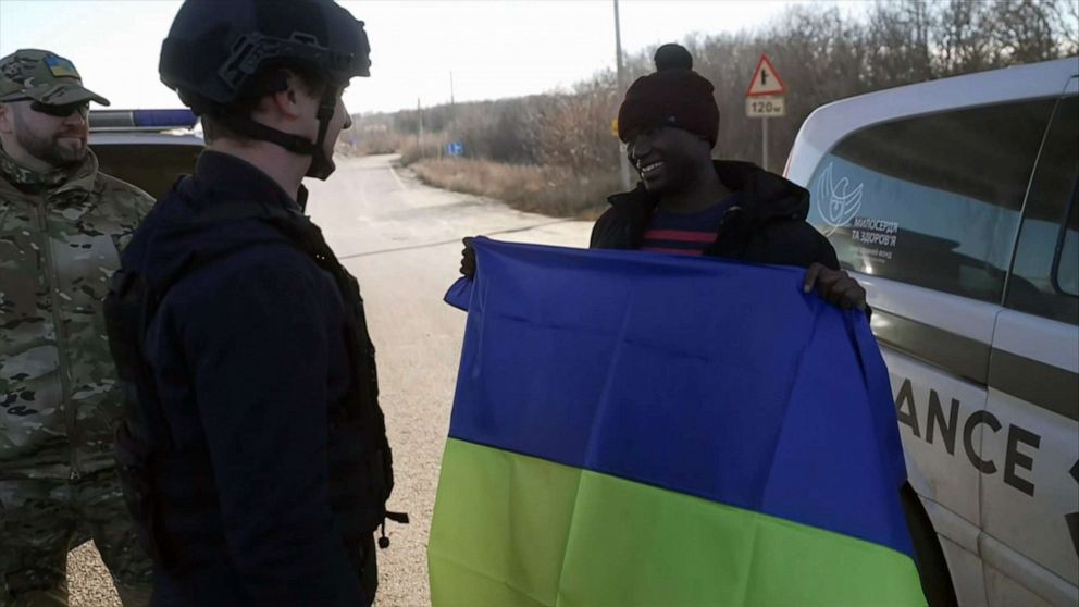 PHOTO: Suedi Murekezi, an American freed from Russian-controlled territory, holds the Ukrainian flag as he speaks with ABC News' Tom Soufi-Burridge in Ukraine, on December 14, 2022.