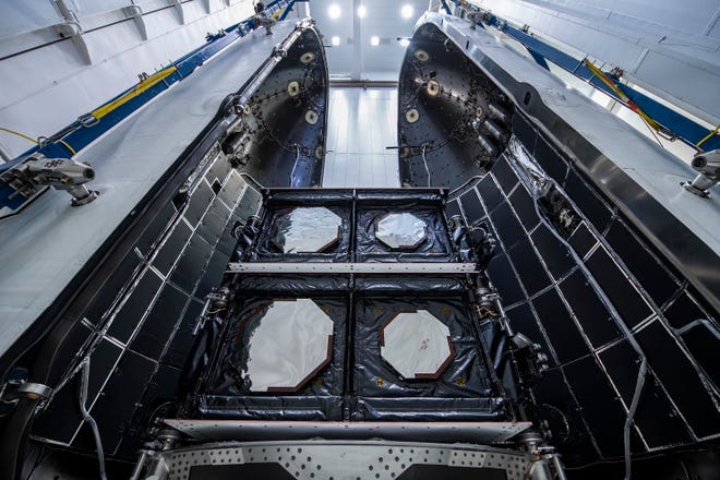 Luxembourg-based satellite operator SES's O3b mPower satellites 1 and 2 are seen during payload integration in the SpaceX Falcon 9 protective payload display before they are mated to the Falcon 9 booster.
