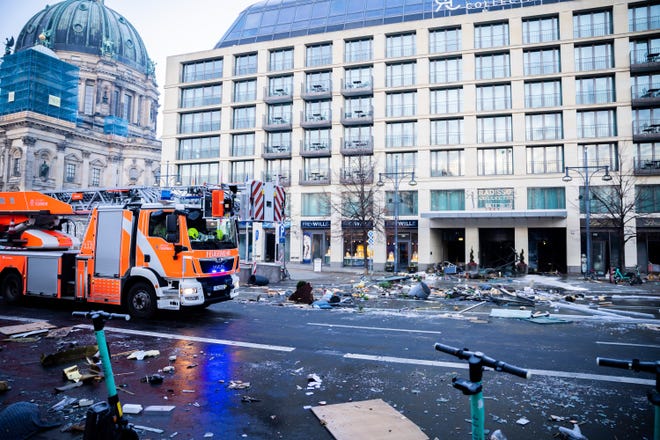 Debris lies in the street after a massive fish tank exploded at the Seal Life Aquarium in central Berlin, Germany, Friday, December 16, 2022. (Christoph Soeder/dpa via AP)